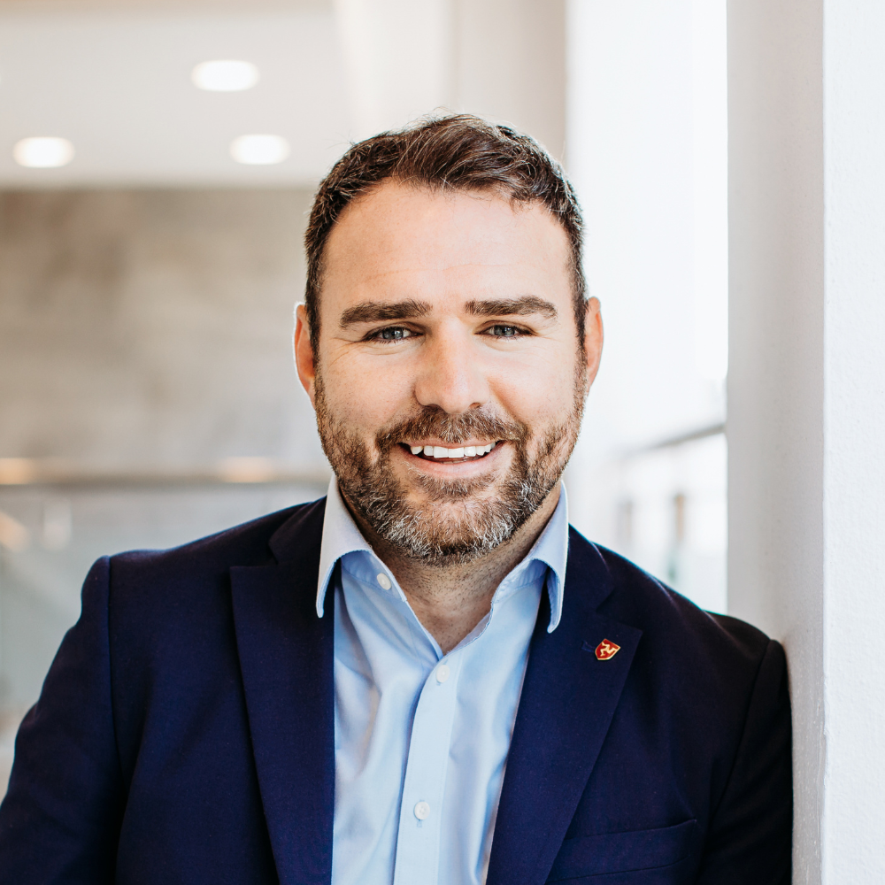 Headshot of ADAM HUDGEON